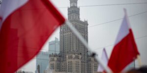 Polish flags in front of the Palace of Culture and Science